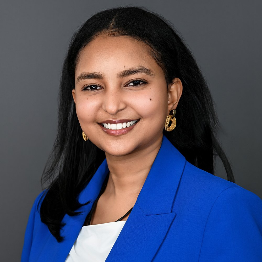 Smiling woman in blue blazer
